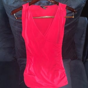 Bright pink cleavage top.